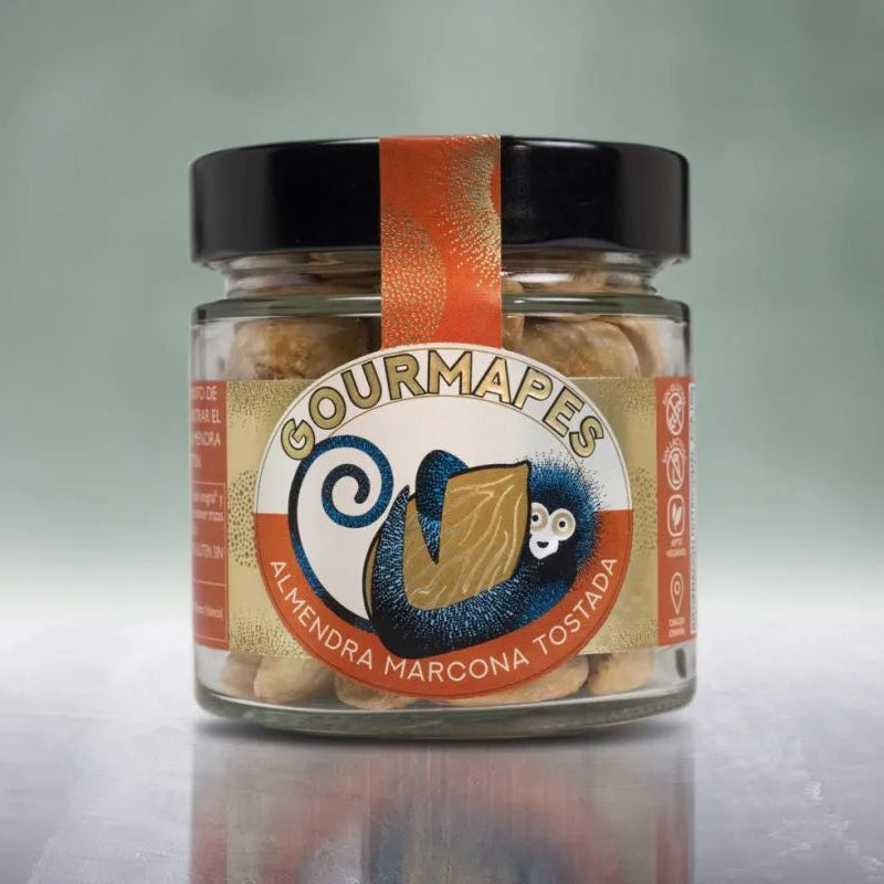 Tarro de almendra marcona tostada a mano, de diseño moderno con colores dorados y naranja y en el centro un mano azul agarrando una almendra.