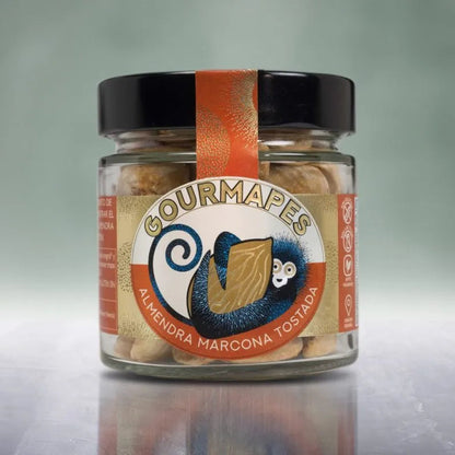 Tarro de almendra marcona tostada a mano, de diseño moderno con colores dorados y naranja y en el centro un mano azul agarrando una almendra.