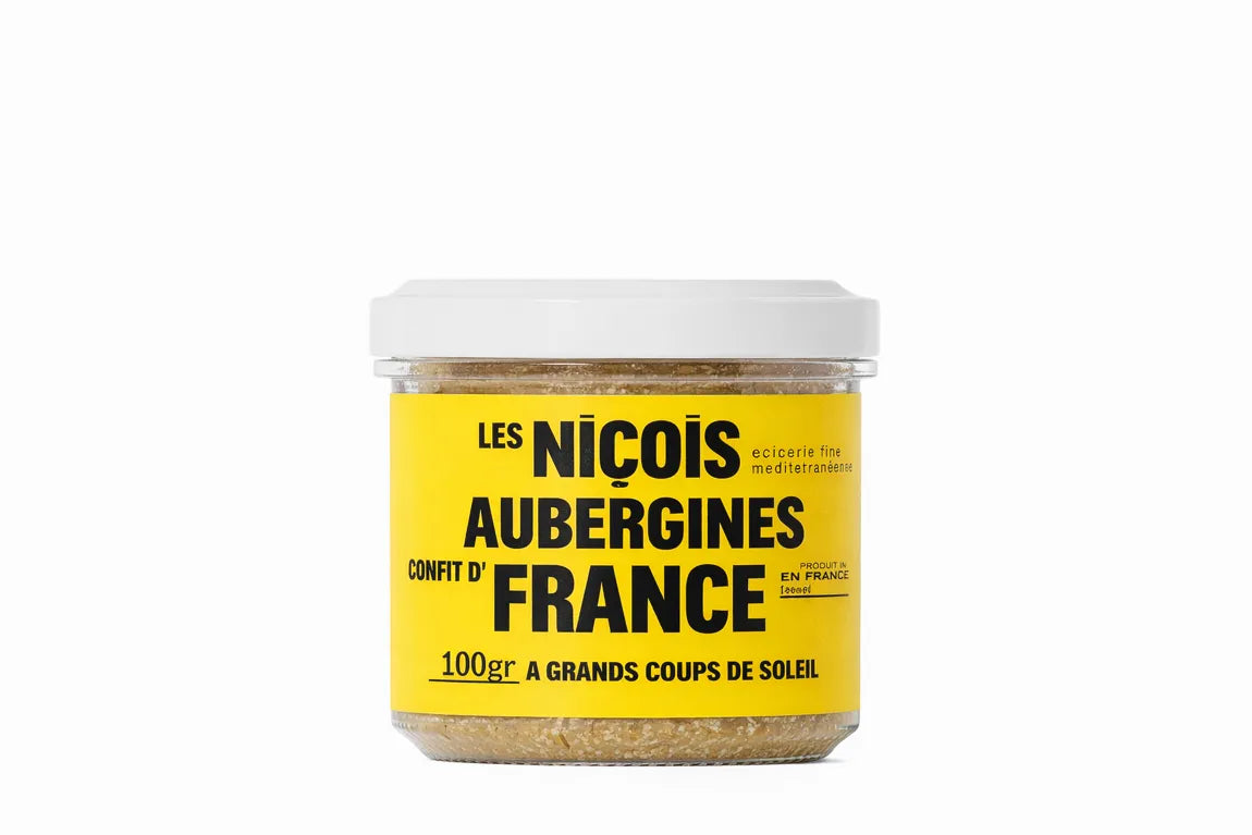 Tarro de dip de berenjena confitada sobre fondo blanco con etiqueta de color amarillo y tipografía negra con el nombre del producto.