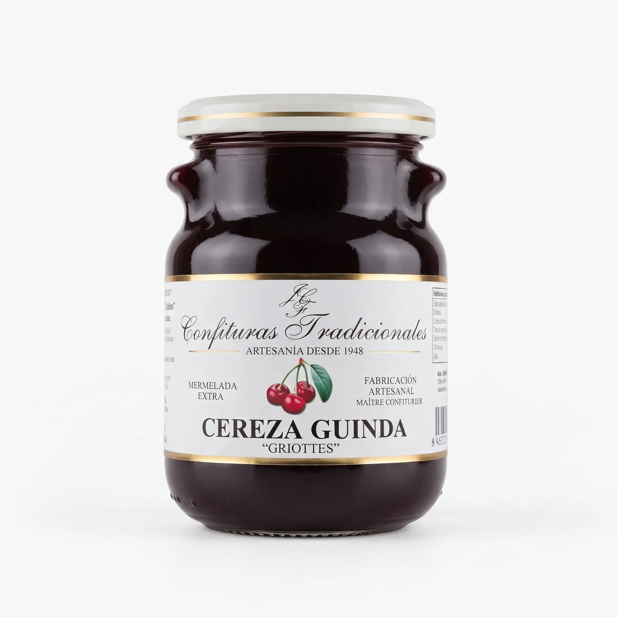 Frasco transparente de confitura tradicional de cereza guinda con etiqueta blanca, dejando ver la mermelada y mostrando la ilustración de cerezas junto a la marca.