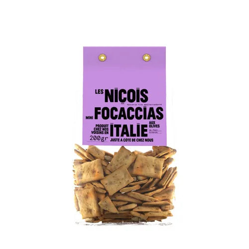 Mini focaccias de aceituna negras, las auténticas italianas en bolsa transparente donde podemos observar el producto. Con etiqueta de color morado y letras negras.