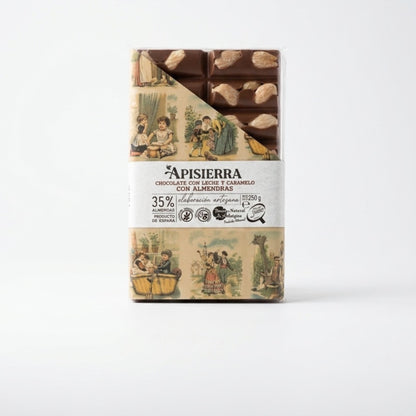 Tableta de chocolate con almendras enteras tostadas a mano realizado de forma artesanal. El diseño nos permite ver un poco la tableta y la otra mitad con un diseño clásico pero muy elegante.